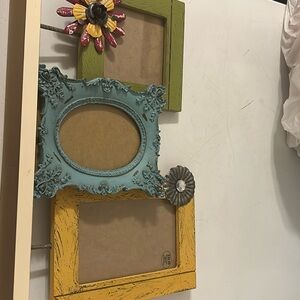Hobby Lobby country picture frames in yellow of, aqua and green w/ metal detail.